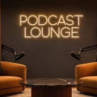 Podcast Lounge Neon Sign Podcast Lounge LED neon sign in warm white in luxury interview studio with high-end furniture