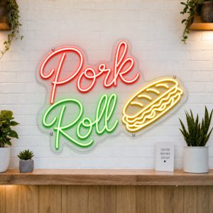 Pork Roll LED neon sign on clear acrylic backing mounted on white brick wall