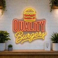 Quality Burgers LED neon sign with stacked burger icon on clear acrylic backing