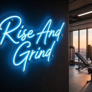 A vibrant Ice Blue 'Rise And Grind' neon sign mounted on a dark, moody training space wall, with cinematic lighting highlighting the realistic LED glow.