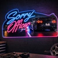 Sorry Officer LED neon sign mounted on garage wall