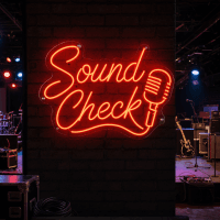 Sound Check neon sign glowing on a black wall