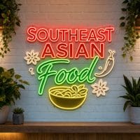 Southeast Asian Food LED neon sign on clear acrylic backing mounted on white brick wall