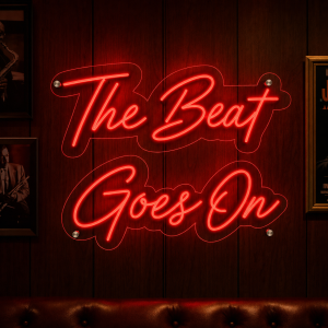 The Beat Goes On Neon Sign glowing in a music venue