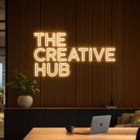 The Creative Hub Neon Sign The Creative Hub LED neon sign in warm white in modern co-working creator office with premium architecture