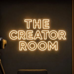 The Creator Room Neon Sign The Creator Room LED neon sign in warm white in cinematic filming setup with realistic cameras