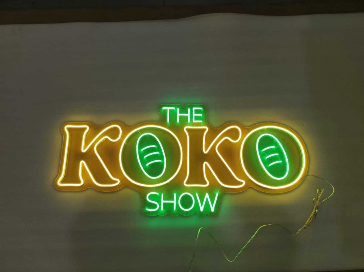 The Koko Show neon sign with yellow and green lights custom made in Australia