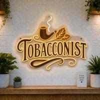 Tobacconist LED neon sign with pipe and tobacco leaf icons on clear acrylic backing