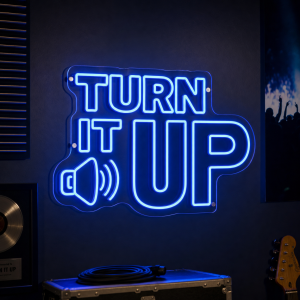 Turn It Up LED neon sign glowing in a music venue