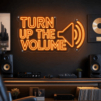 Turn Up The Volume LED neon sign glowing on wall