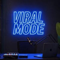 Viral Mode Neon Sign Viral Mode LED neon sign in electric blue in TikTok creator room with premium influencer setup